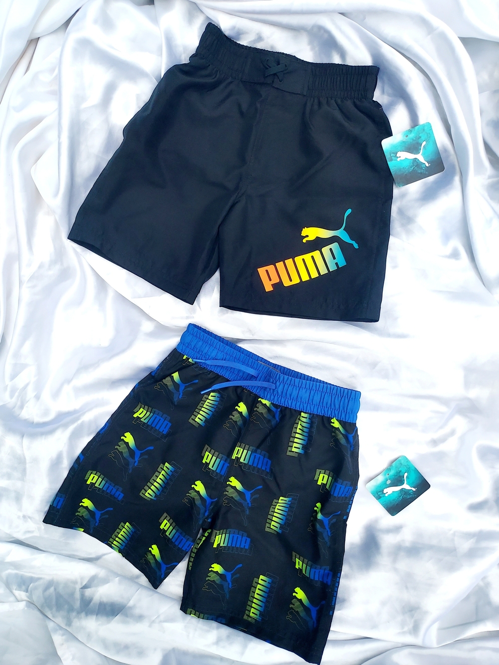 Puma Black Kids' Swim Shorts with Blue and Yellow Logo Accents